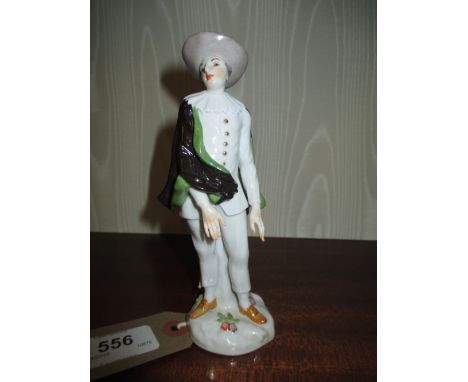 20th Century Meissen figure of a man wearing a wide brimmed hat with black and green cloak, 6ins high