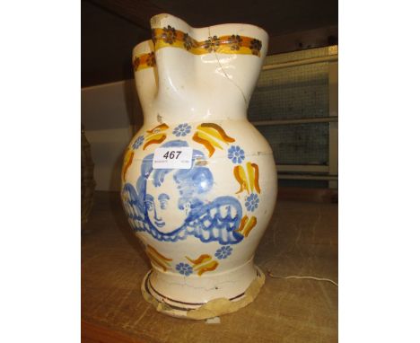 19th Century French Faience Creamware jug decorated with a portrait of a cherub (a/f)