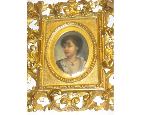 19th Century K.P.M. type porcelain plaque painted with a portrait in a Florentine style carved and gilded frame, the plaque 5