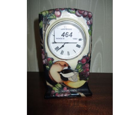 Moorcroft tube line decorated mantel clock decorated with birds on a dark blue ground
