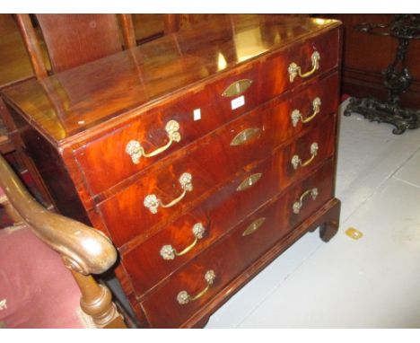 George II mahogany dwarf chest, the crossbanded top above four graduated drawers with brass swan neck handles raised on brack