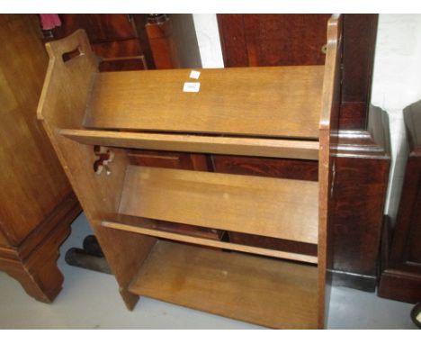 Liberty & Company oak three shelf bookcase with pierced clover leaf design ends, label to base