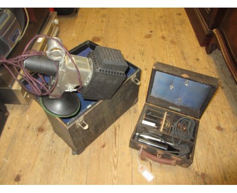 Vintage SVE film strip projector together with a quantity of film reels, a large Ampro cased projector and a cased electric t