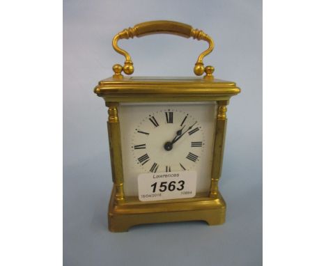 Small French brass cased carriage clock, the enamel dial with Roman numerals and single train movement
