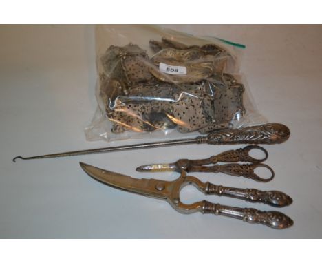 Quantity of Continental buckles and belts, large silver handled button hook, pair of silver handled shears and a pair of plat