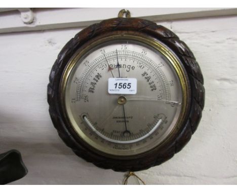 Circular oak cased aneroid barometer / thermometer by John Barker, Kensington