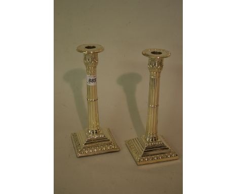 Edwardian silver fluted column candlestick, London, 1901, together with a similar unmarked candlestick