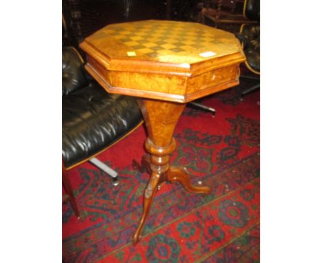 Victorian figured walnut octagonal trumpet form games / work table, the chequer board top enclosing a fitted interior above a