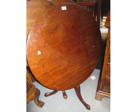 19th Century circular mahogany tripod table, having tilt top with turned column and cabriole pad supports (height reduced)