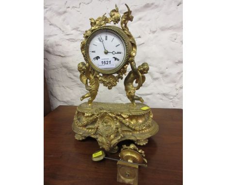 19th Century French ormolu mantel clock with cherub supports, the enamel dial with Roman numerals, the two train movement str