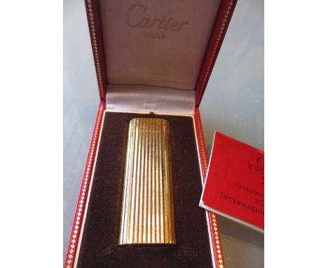 Cartier gold plated cigarette lighter in original box