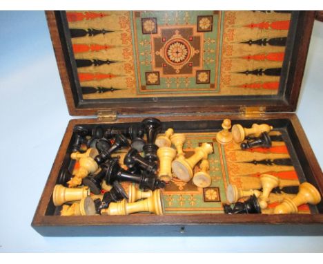 Edwardian mahogany and boxwood folding chess and backgammon gaming board with ebony and boxwood chess set, 12ins x 12ins open