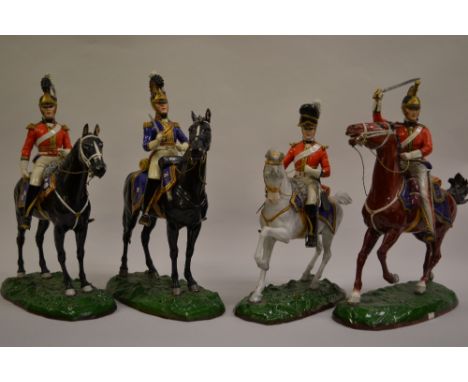 Set of four Sitzendorf porcelain equestrian figures of mounted Napoleonic officers each approximately 14.5ins high