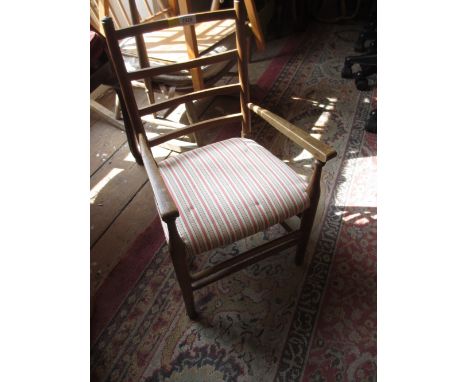 Child's beechwood ladder back elbow chair and a mahogany firescreen with needlework panel and brass handle