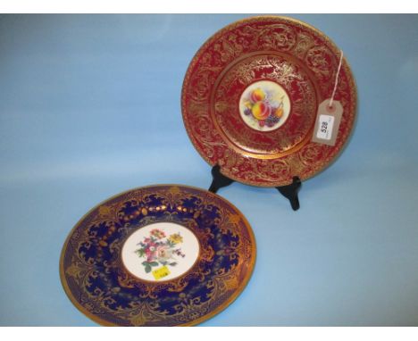 Royal Worcester cabinet plate painted with fruits, signed P. Stanley within a cerise and gilt border together with a similar 