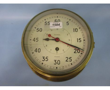 Brass cased ships bulk head clock by Astral, the painted dial with Arabic numerals and sweep seconds hand with a single train