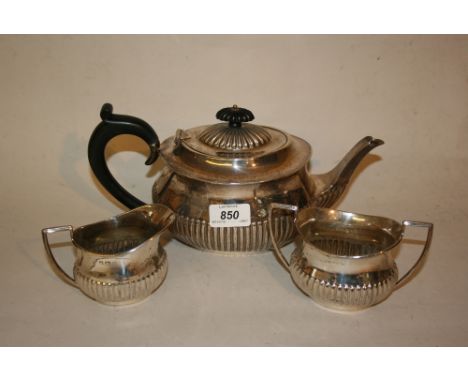 Early 20th Century Birmingham silver three piece tea service of oval half fluted design