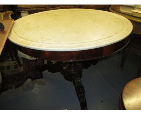 19th Century circular French mahogany centre table with a marble top raised on turned and carved centre column with tripod ba