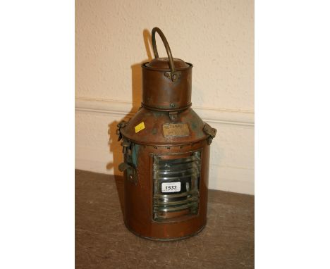 Circular hanging copper ship's signalling lamp, marked Meteorite