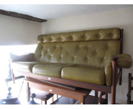 Guy Rogers buttoned leather upholstered three seat sofa together with a matching armchair