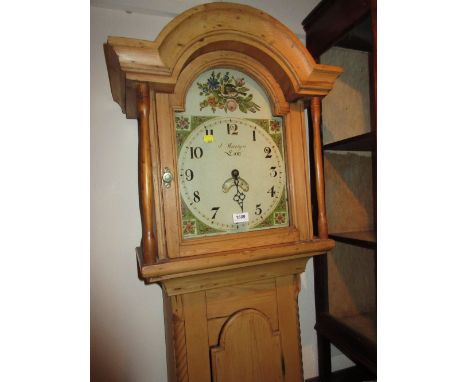 19th Century stripped pine longcase clock, the broken arch hood above an arched panel door flanked by rope pattern quarter pi