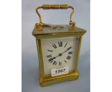 French gilt brass carriage clock with enamel dial and Roman numerals and a two train striking movement