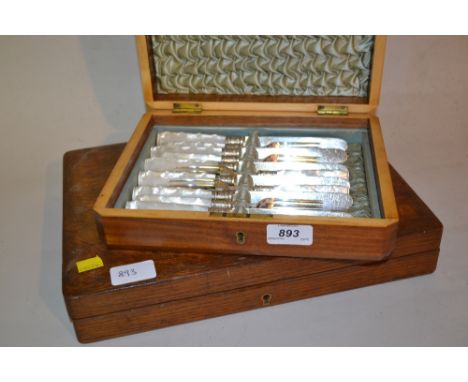 Walnut cased set of six plated and mother of pearl fruit knives and forks, together with an oak cased part set of plated cutl