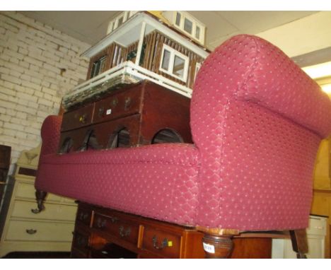 Victorian burgundy button upholstered Chesterfield sofa, raised on low turned front supports