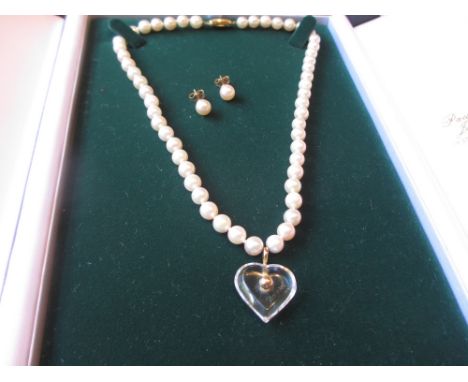 Cultured pearl necklace with a 9ct gold clasp with attached Baccarat heart shaped pendant together with a pair of cultured pe
