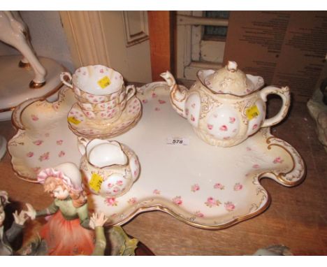 George Jones crescent china tea service for two decorated with roses and gilding including a large shaped edge tray