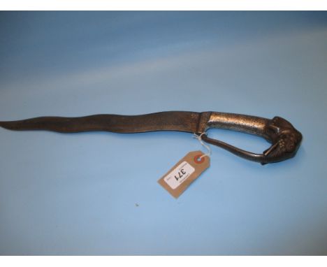 Asian dagger, the wavy figured blade with niello work elephant form handle with guard