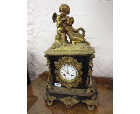 19th Century French ormolu and slate mantel clock mounted with a figure of a seated winged cherub with a young girl holding a