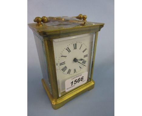 Gilt brass cased carriage clock with an enamel dial and Roman numerals