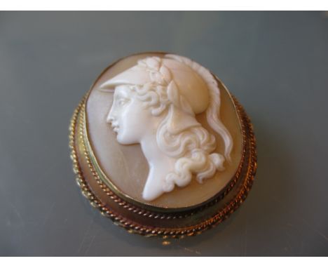 9ct Gold mounted oval cameo brooch, carved in deep relief with a profile portrait of a classical female warrior