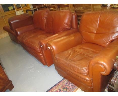 Mid tan leather three piece sitting room suite comprising: two seat sofa and pair of matching armchairs