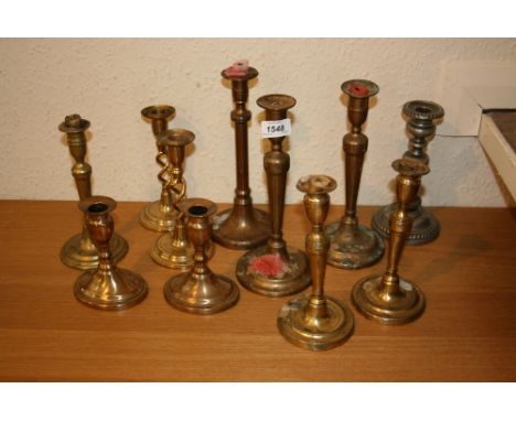 Pair of 19th Century brass candlesticks with ejectors, together with a similar smaller pair, a quantity of other brass candle