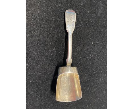 A hallmarked for London 1820 silver caddy spoon with crest to handle, maker Robert Pringle , 31g 