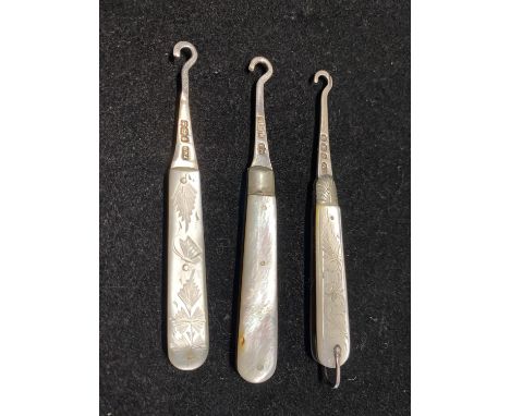 Three hallmarked silver Victorian bladed button hooks with silver handles 