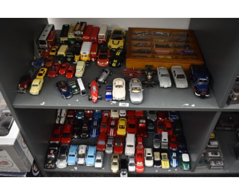 Two shelves of modern playworn diecasts including Corgi, Solido, Kinsmart, Days Gone etc, along with a modern 12 car display 