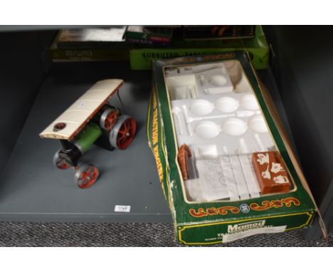 A Mamod Live Steam TE1 Steam Tractor with a Mamod Traction Engine Kit box