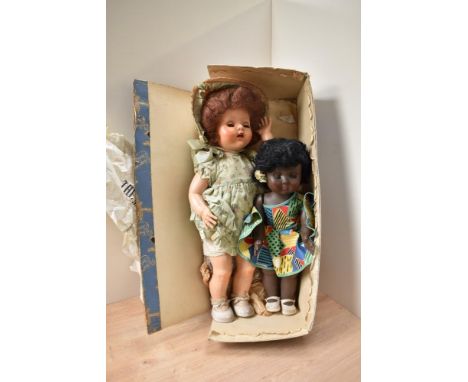 A Pedigree Celluloid Walking Doll, fully clothed, length 55cm in original box with wrapping paper from The Model Shop, 8 Chin