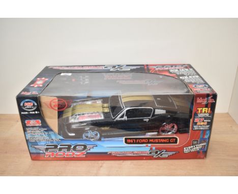 A Maisto 1:12 scale Pro Rodz Radio Controlled 1967 Ford Mustang GT, in original display box, appears unopened