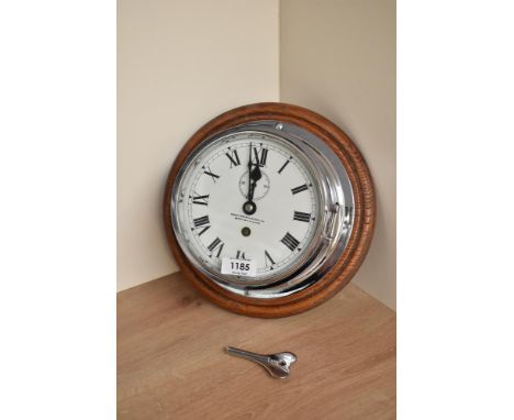 A Henry Browne &amp; Son Ltd, Barking, London chrome bulkhead clock with enamelled dial, roman numerals, spade hands and seco