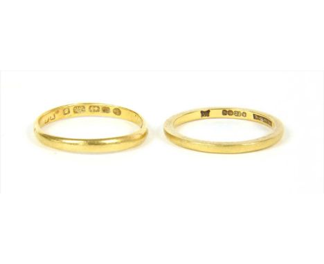 Two 22ct gold wedding rings, London 1950 and Birmingham 1875, finger size K and O, 3.83g total (2)