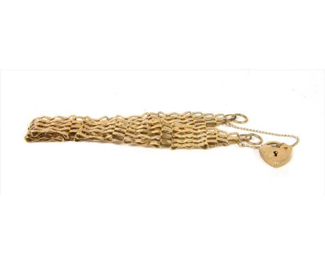 A 9ct gold five row gate bracelet, with crimped bars to heart shaped padlock clasp and safety chain, London 1988, 7.70g