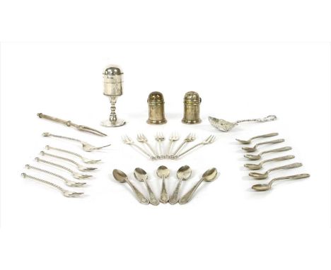 A collection of silver items , comprising of table lighter, flatware, pepperettes, strainer, etc (Qty.)