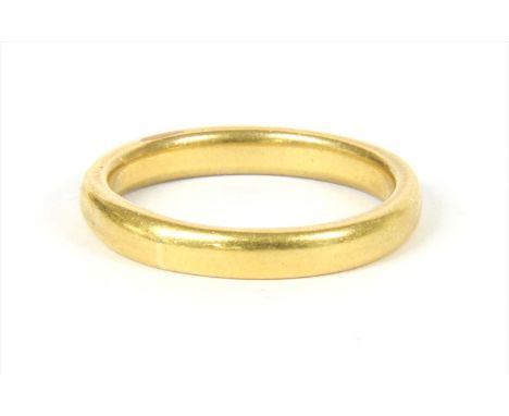 A gold wedding ring, hallmark worn , Birmingham, tested as approximately 22ct gold, 7.62g Finger size T