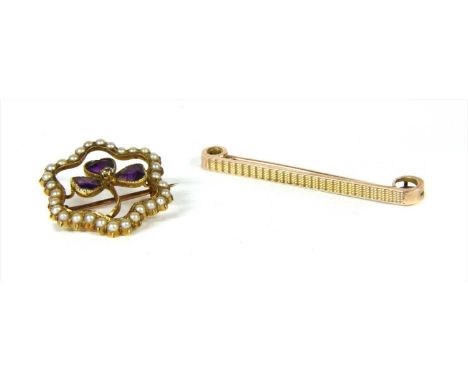 A Victorian gold diamond, amethyst and split pearl shamrock brooch, with an old brilliant cut diamond claw set to the centre,