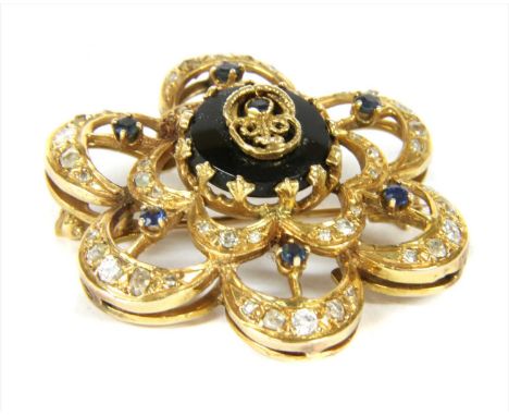 A gold sapphire, onyx and diamond brooch/pendant, designed as an openwork flowerhead, with a central onyx tablet with applied