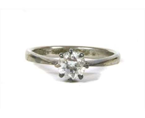 A single stone diamond ring, with a brilliant cut diamond, claw set to a rex collet, with solid tapered shoulders and a plain